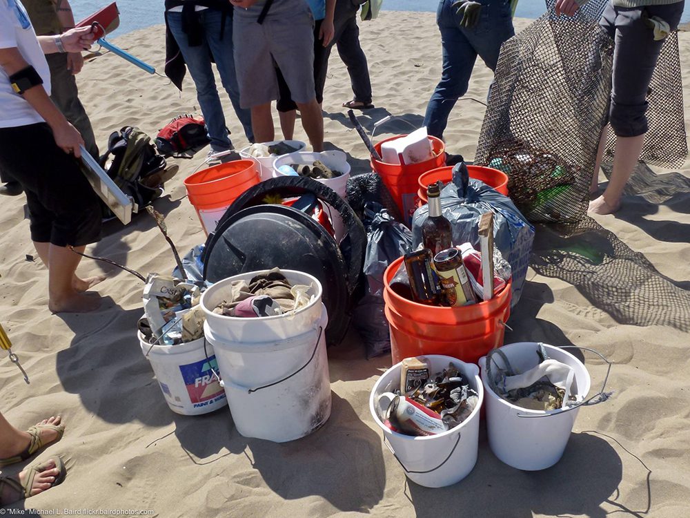 10 buckets full of trash that was picked up on the beach.